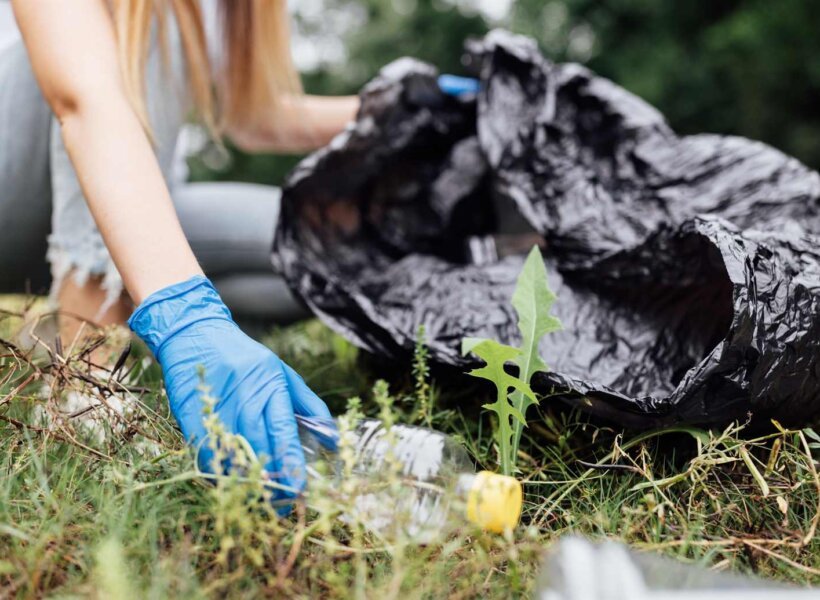 young-caucasian-woman-cleaning-up-public-park-or-f-2022-08-01-03-46-51-utc